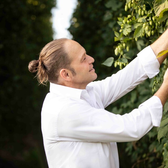 Johann Brenner tests the hops